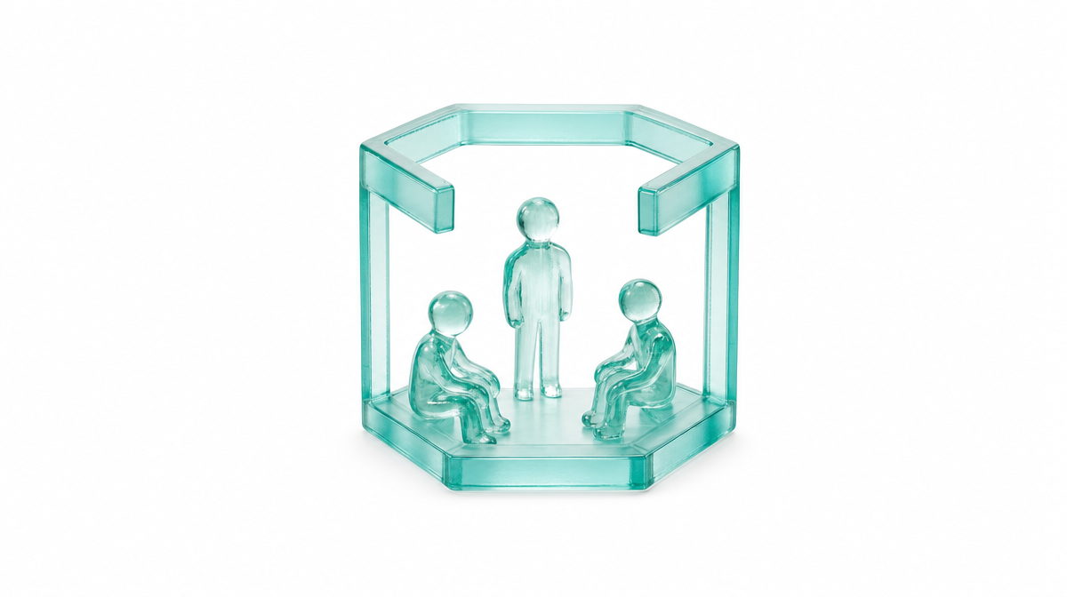 Cluster of translucent glass figures gathered inside an open glass hexagon room